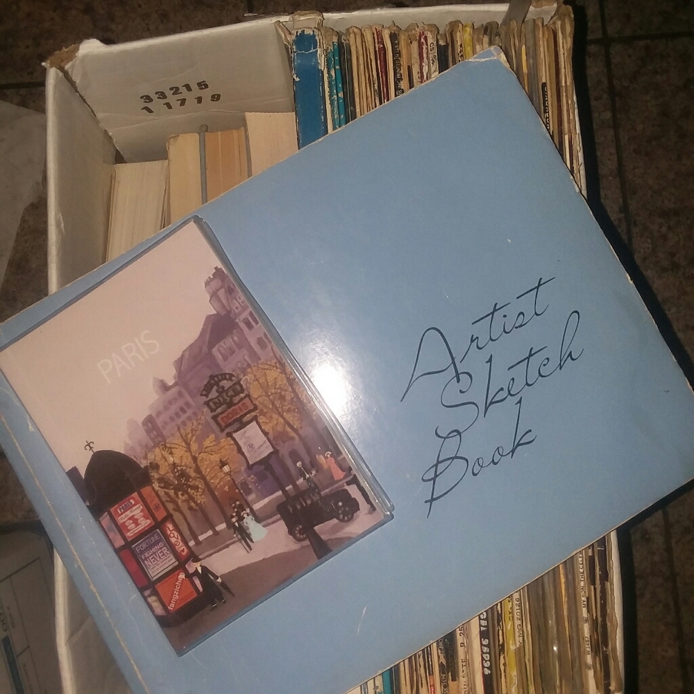 A new mini paris notebook and a used artist sketch